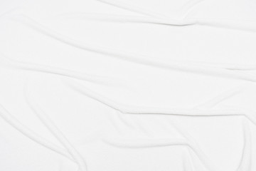 White crumpled blanket; texture; top view; abstract; background