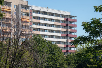 Typical modernized residential buildings in Leipzig district Grünau with blue sky, architecture...
