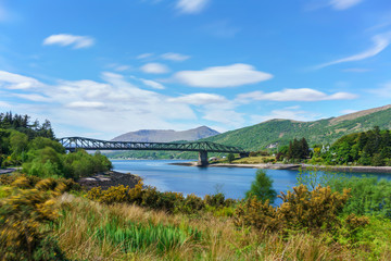 Fototapeta premium Ballachulish Bridge crosses the narrows between Loch Leven and Loch Linnhe , Scotland