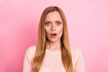 Portrait of disappointed astonished lady hear incredible novelty open mouth isolated over pink background
