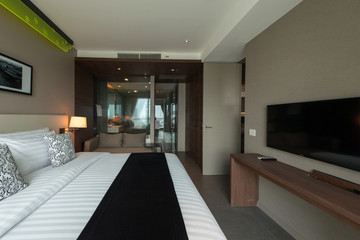 Interior of modern bedroom with cozy double bed