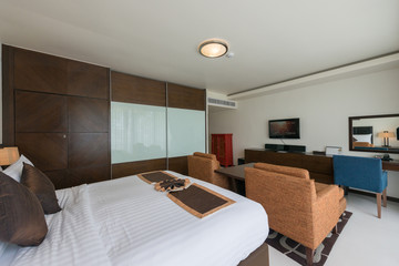 Interior of modern bedroom with cozy double bed