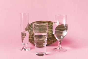 Variety of water glasses and melon