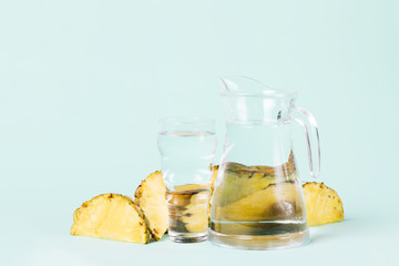 Cut slices of pineapple with water jug