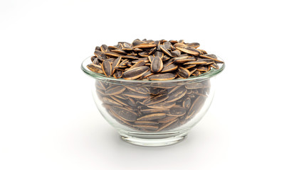 Sunflower seed in a bowl on a white background.