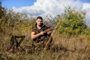 What you should have while hunting nature environment. Recharge rifle concept. Hunting equipment and safety measures. Man with rifle hunting equipment nature background. Prepare for hunting