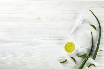 Minimalistic composition of sliced aloe vera leaves, for making moisturizing skincare gel. Organic home made cosmetics concept. Close up, copy space, top view, flat lay.
