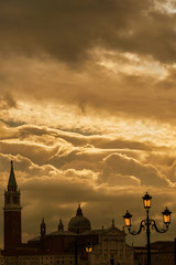 Beautiful golden clouds on St George Basilica in Venice (with copy space above)