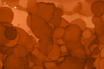 Hand painted alcohol ink background. Abstract delicate orange texture. Contemporary autumn wallpaper. 