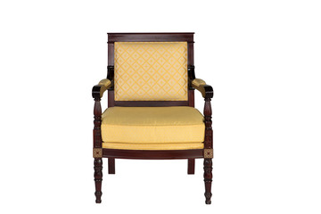 Brown arm chair with yellow material on white background.