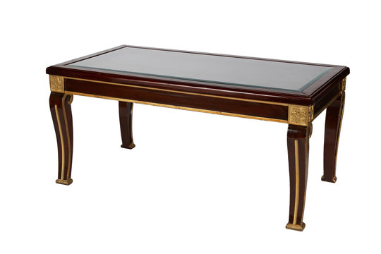 Luxury wooden table with glass top and golden details