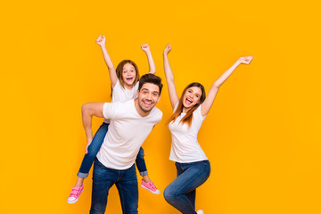 Portrait of three nice attractive charming cute lovely stylish cheerful cheery childish playful glad ecstatic person having fun dancing isolated over bright vivid shine yellow background