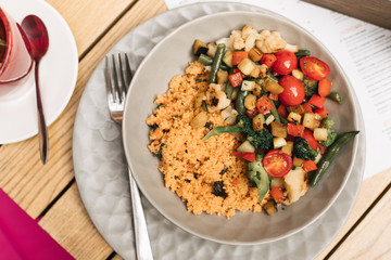 a plate of couscous with vegetables