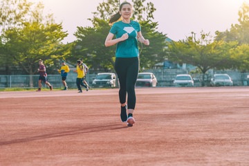 Runner Women jogging or running in evening at sunlight