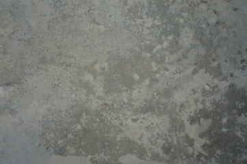 Rough plaster and cement grunge background texture. Grain, fragments and pieces.