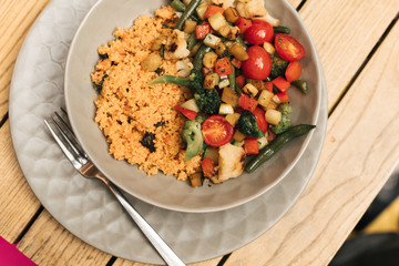 a plate of couscous with vegetables