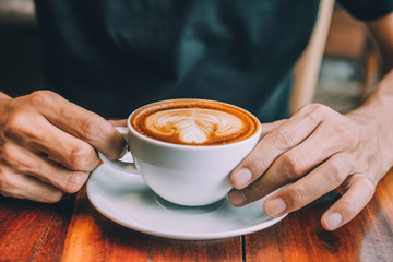 Man sitting in coffee shop for drink in coffee time