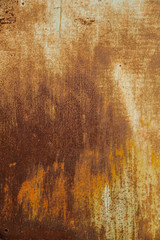 Rusty orange metal background with spots and scratches.