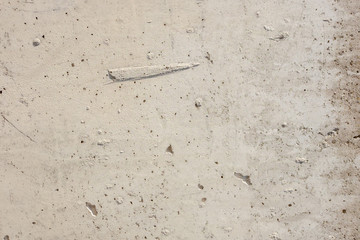Light concrete surface with flaws