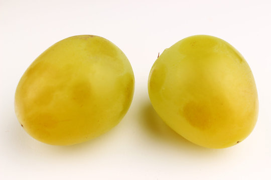 White Laura grapes on a white background
