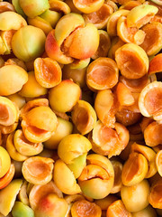 Sweet ripe juicy orange apricots. Fruit halves. The concept of the summer harvest, canning. Apricot day. Slices the workpiece to jam.