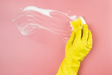 Close-up hand with glove cleaning up