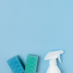 Arrangement with cleaning products on blue background
