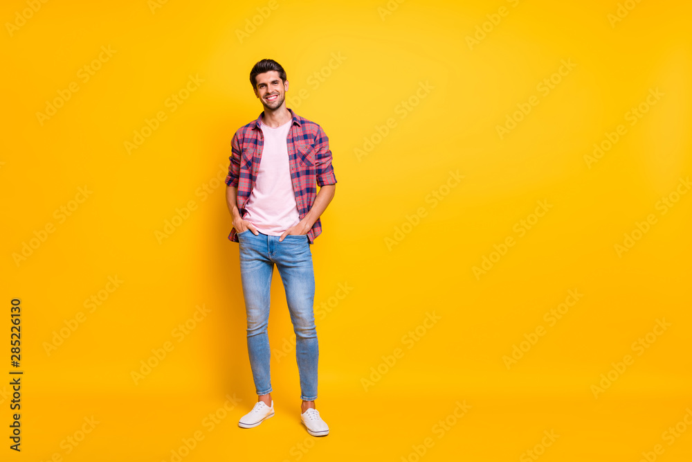 Poster Full length body size photo of enjoying guy posing in front of camera while isolated with yellow background