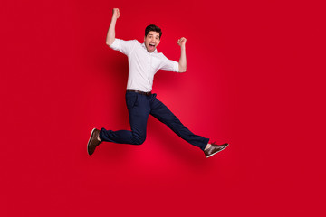 Full length body size view of his he nice attractive lovely cheerful cheery content overjoyed guy having fun rejoicing isolated over bright vivid shine red background