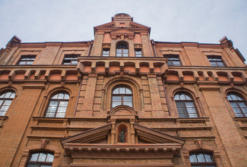 Old beautiful red architectural building in the city.