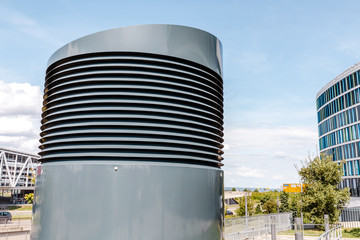 Modern air ventilation system near big office building