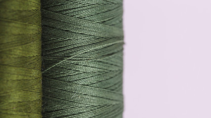 Line of green thread reels