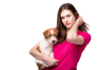 Pretty girl with terrier puppy. Studio image