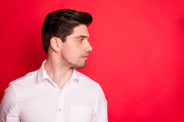 Close up photo of handsome attractive man showing his hairstyle while isolated with red background