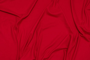 Red crumpled blanket, texture, top view