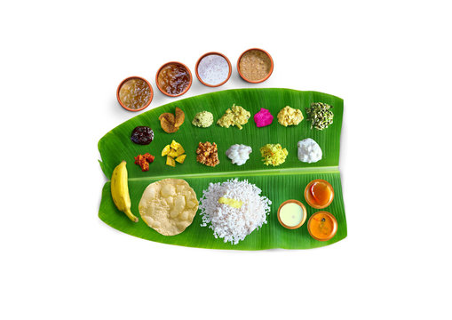 Traditional food Onam Sadya served on a banana leaf on Festival day onam,  Vegetarian meal with rice and curries, kerala food, Kerala, india, 