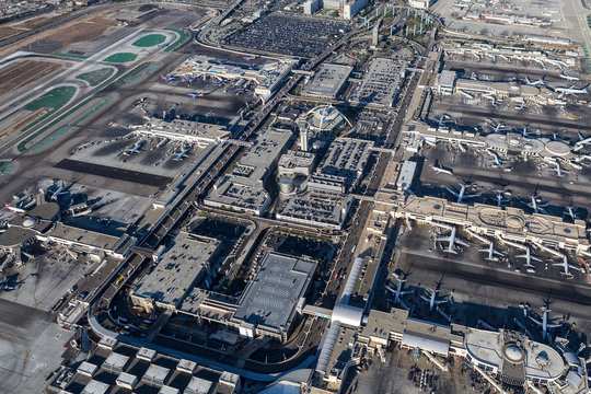 Afternoon aerial view of busy terminals and loop road at LAX airport on August 16, 2016 in Los Angeles, California, USA.