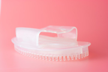 Anticellulite bath, shower silicone massager for body isolated on pink background.