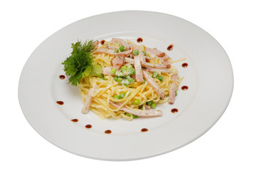 Stir-fried noodles, mixed greens in white sauce on a white isolated background