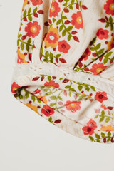 White sleeve with red flowers close-up