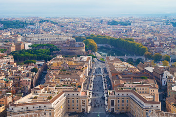 Fototapeta premium View of street leading to Castel Sant'Angelo and arched bridges across Tiber river
