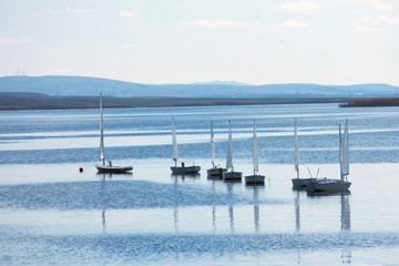 small sailboats on the lake