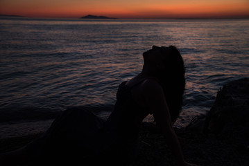 silhouette of woman at sunset