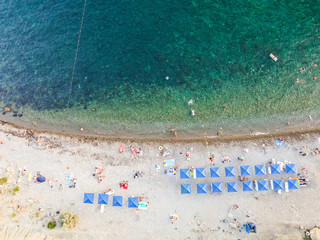 Bird's-eye view. Sea beach people swimming sunbathing relaxing. Human footprints in the sand. CRIMEA KOKTEBEL AUGUS 11 2019