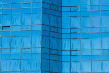 high building with glass facade fragment as background