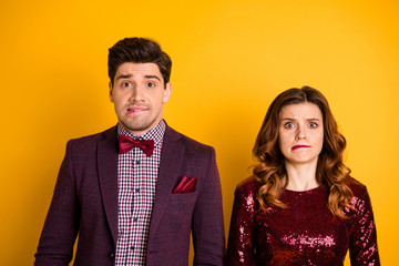 Close-up portrait of his he her she nice-looking attractive lovely glamorous chic classy confused people biting lips isolated over bright vivid shine yellow background