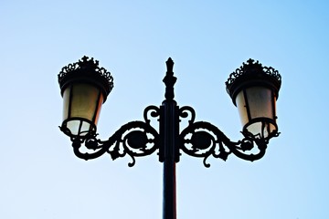 Fototapeta na wymiar Old street lamps on the streets of the city as a reminder of years gone by
