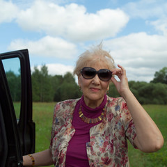 senior female near a car