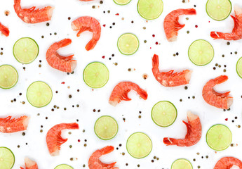 Pattern of shrimp, lime and spices on a white background, top view, flat lay. Seafood background