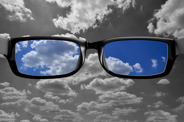 View through glasses of cloud in color